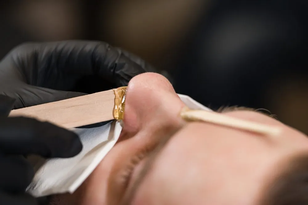 Nose,Hair,Wax,Removal.,Hair,Removal,Procedure,In,A,Barbershop.